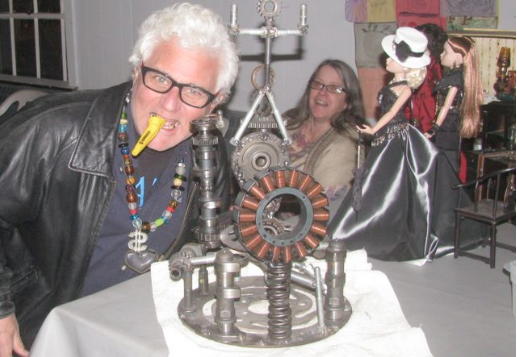 Dave Channon, Coordinator of the Shandaken Pan Arts Festival, plays the kazoo at the feet of the Steam Punk altar, as Mary Herrmann looks on during the Vaudeville Comes to Pine Hill event on January 15, 2012. Photo by Rusty Mae Moore. 